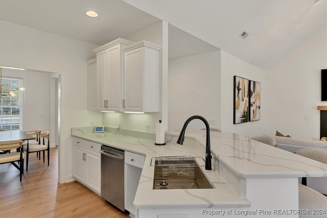 512 Maple Leaf Way Lumberton, NC 28358 - Photo 15 of 50 a kitchen with a sink and a stove top oven