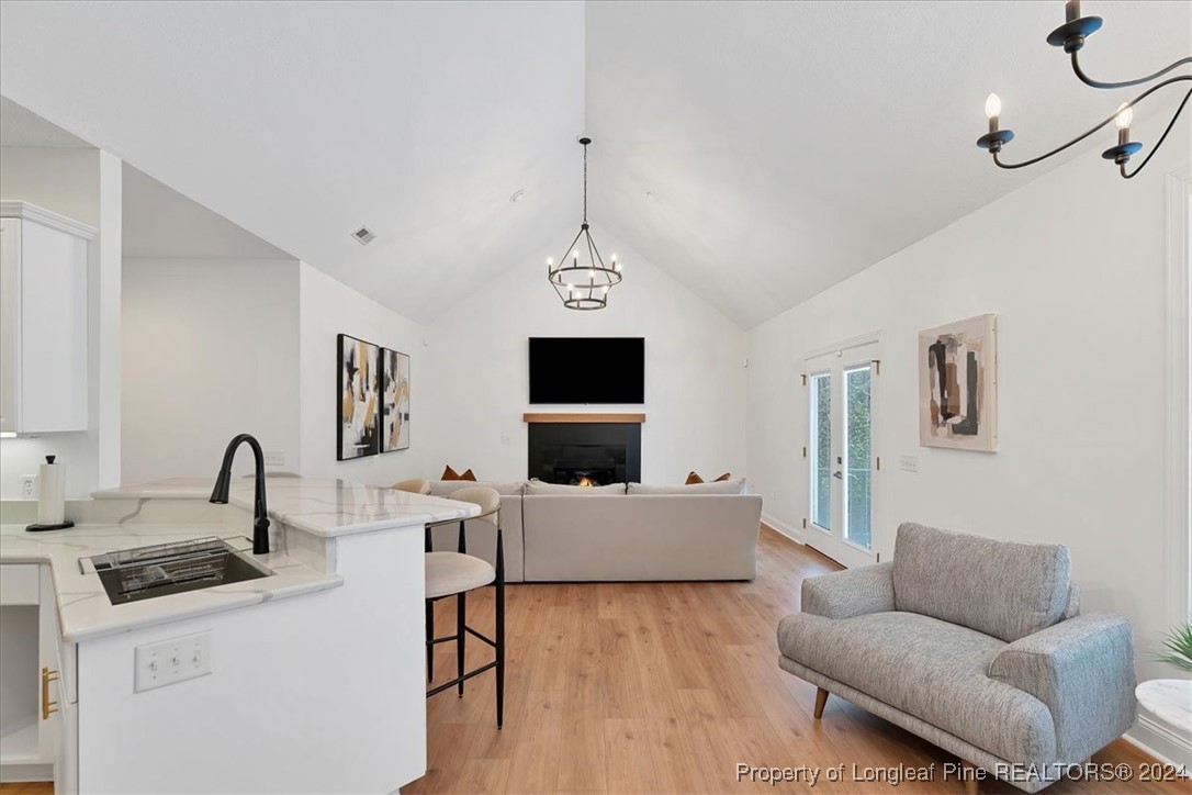 512 Maple Leaf Way Lumberton, NC 28358 - Photo 22 of 50 a living room with furniture a window and a flat screen tv