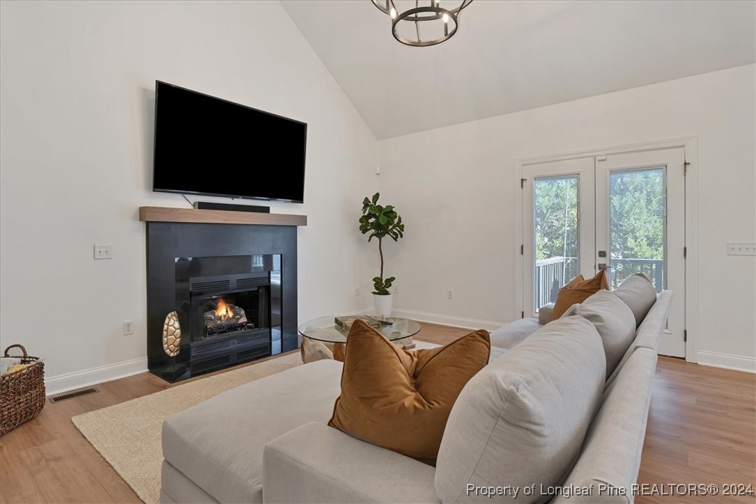 512 Maple Leaf Way Lumberton, NC 28358 - Photo 23 of 50 a living room with furniture a fireplace and a flat screen tv
