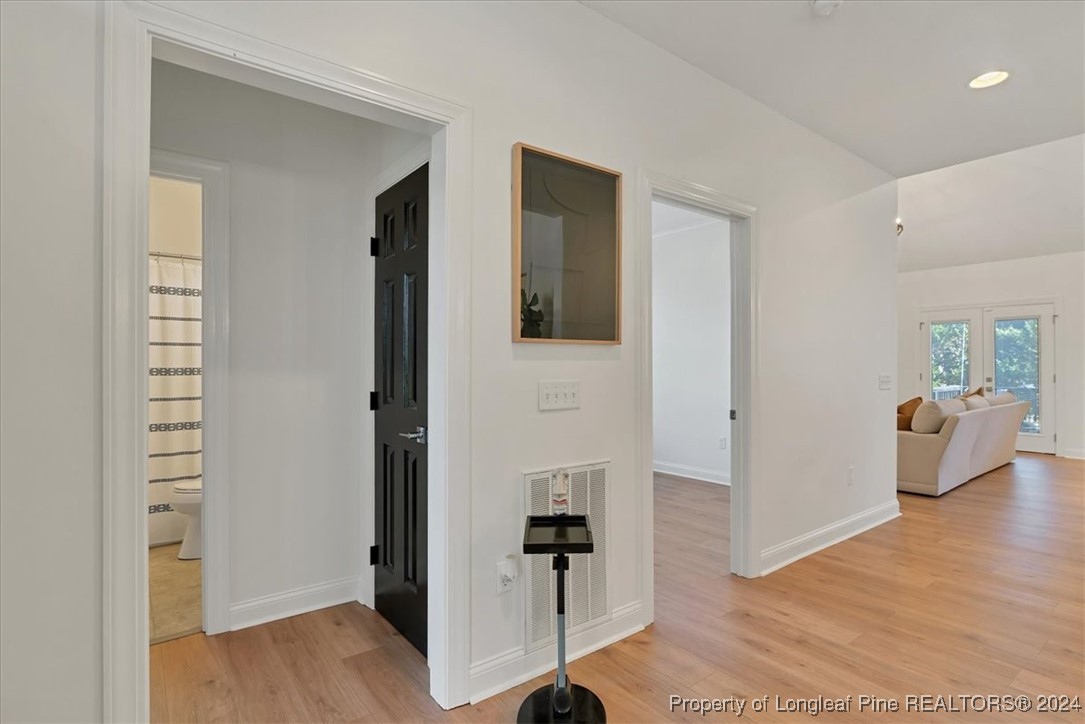 512 Maple Leaf Way Lumberton, NC 28358 - Photo 27 of 50 a view of a hallway with bathroom and wooden floor