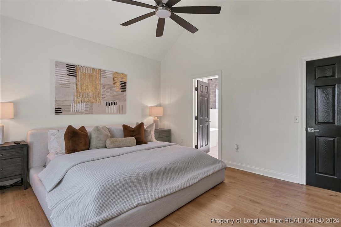 512 Maple Leaf Way Lumberton, NC 28358 - Photo 33 of 50 a bedroom with a bed and a ceiling fan