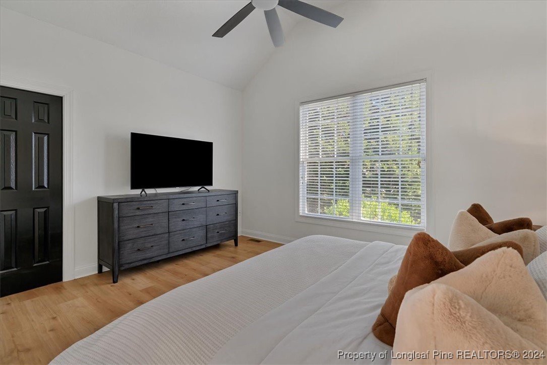 512 Maple Leaf Way Lumberton, NC 28358 - Photo 34 of 50 a bedroom with a bed and a flat screen tv