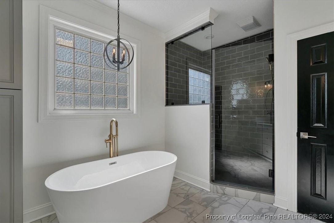 512 Maple Leaf Way Lumberton, NC 28358 - Photo 38 of 50 a bathroom with a bathtub and shower
