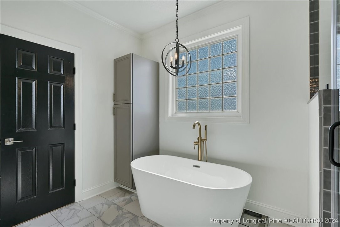 512 Maple Leaf Way Lumberton, NC 28358 - Photo 40 of 50 a bathroom with a sink a toilet and shower