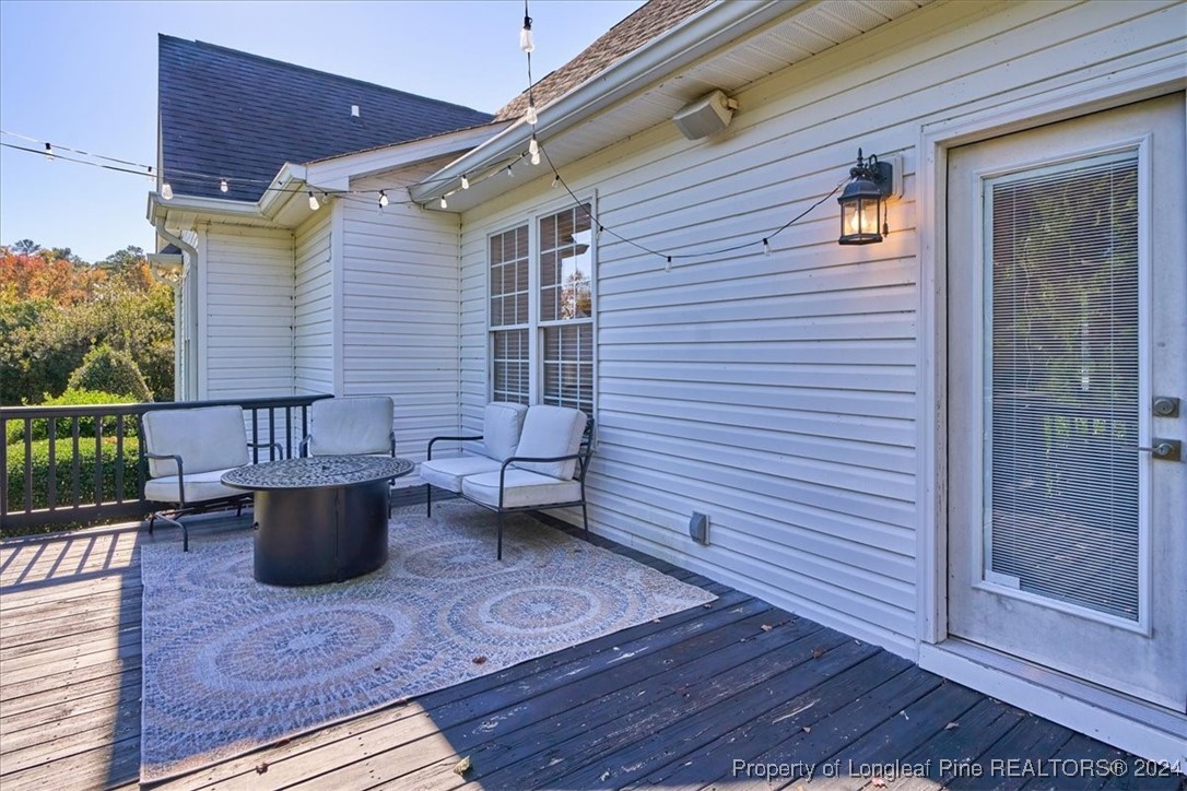 512 Maple Leaf Way Lumberton, NC 28358 - Photo 47 of 50 a view of a patio with table and chairs