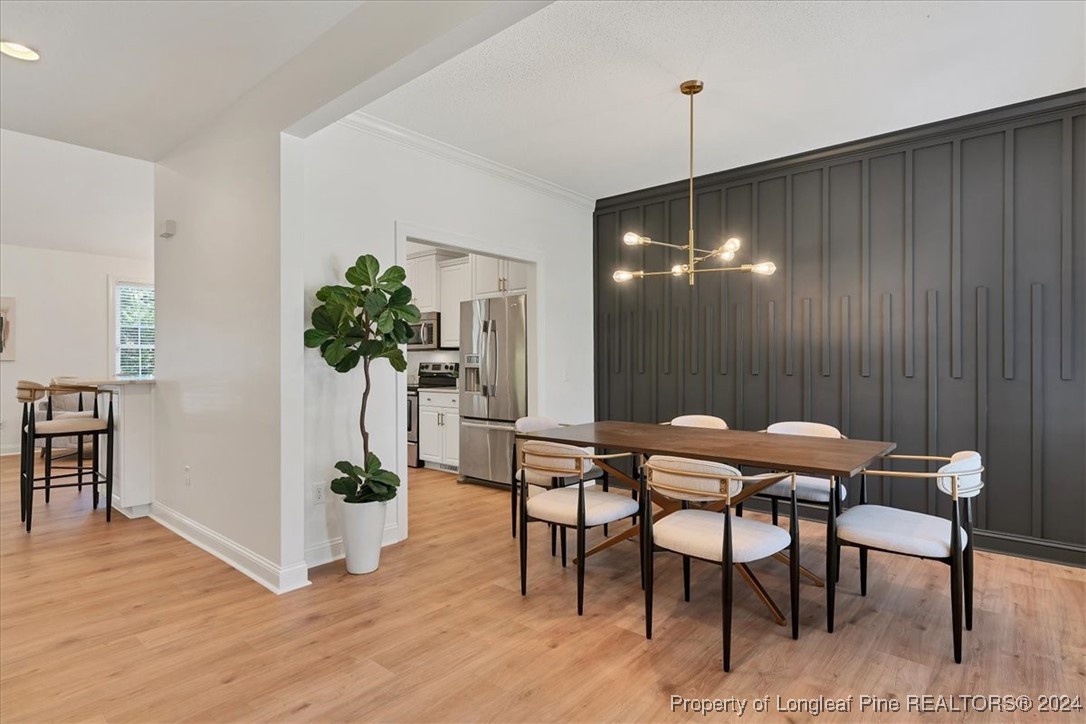 512 Maple Leaf Way Lumberton, NC 28358 - Photo 6 of 50 a view of a dining room with furniture and wooden floor