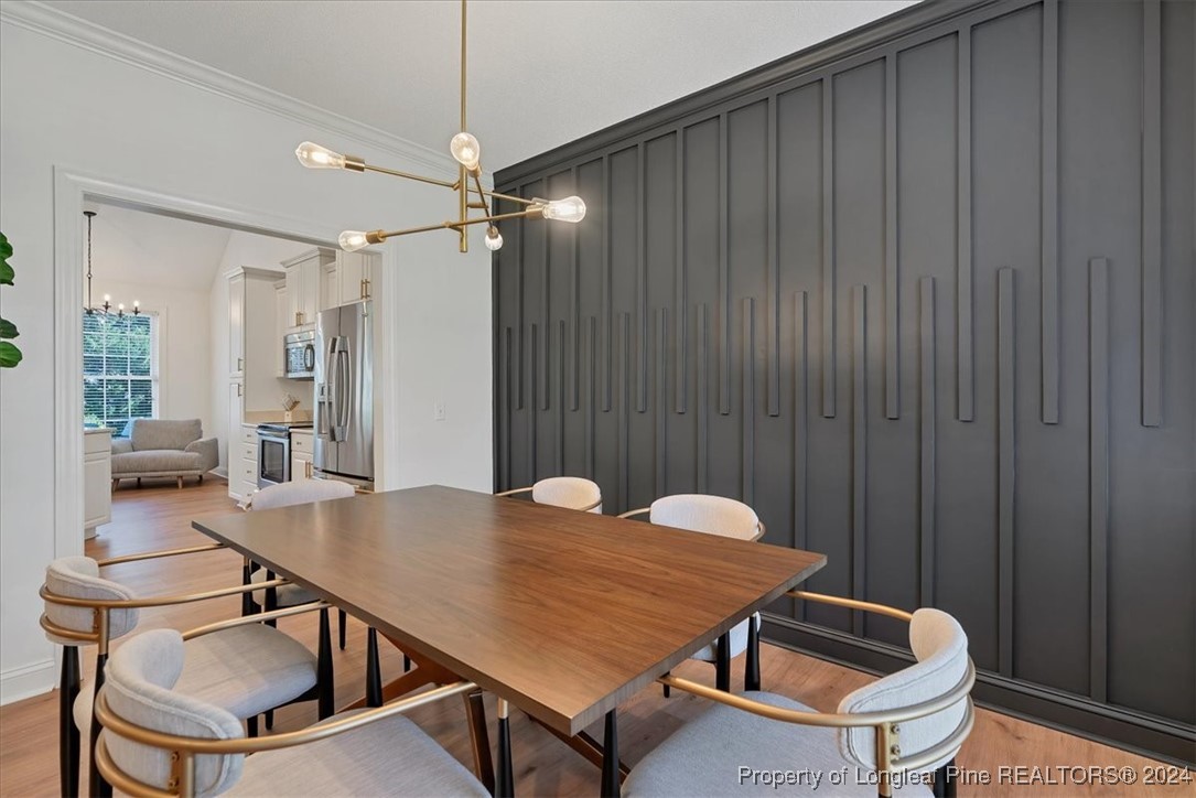 512 Maple Leaf Way Lumberton, NC 28358 - Photo 8 of 50 a outdoor dining space with furniture and wooden floor