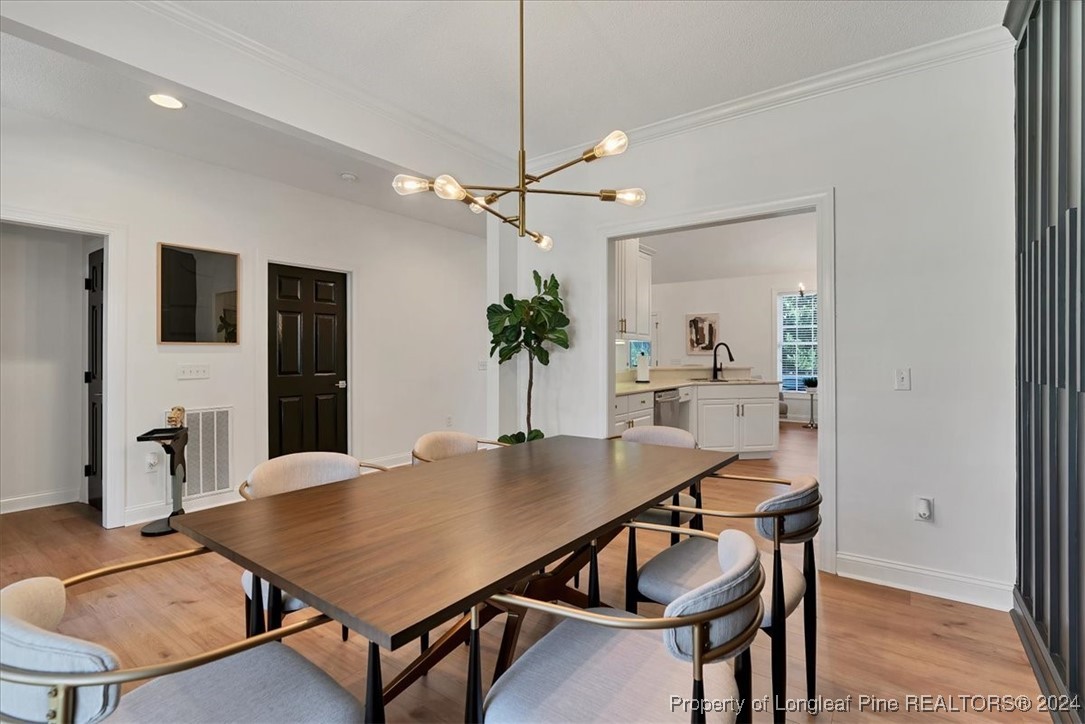 512 Maple Leaf Way Lumberton, NC 28358 - Photo 9 of 50 a dining room with furniture and window