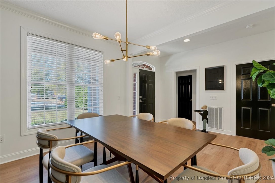 512 Maple Leaf Way Lumberton, NC 28358 - Photo 10 of 50 a view of a dining room with furniture and wooden floor