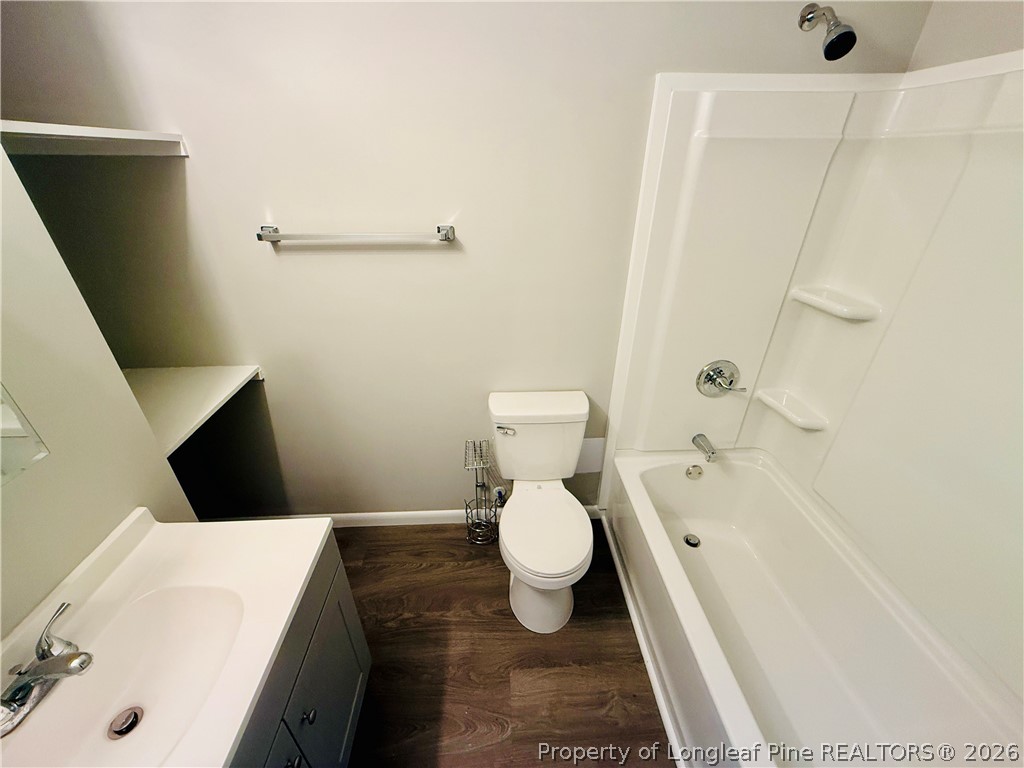 4736 Rosehill Road Fayetteville, NC 28311 - Photo 14 of 15 a bathroom with a toilet and a bathtub