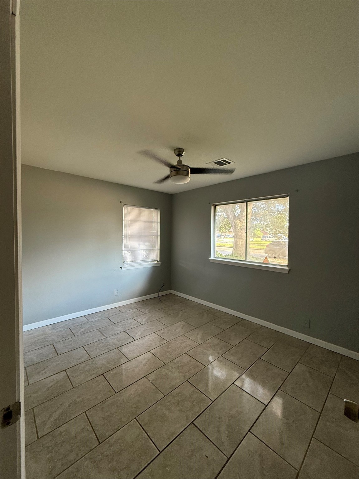 9526 Hammerly Boulevard Houston, TX 77080 - Photo 3 of 16 a view of an empty room and window