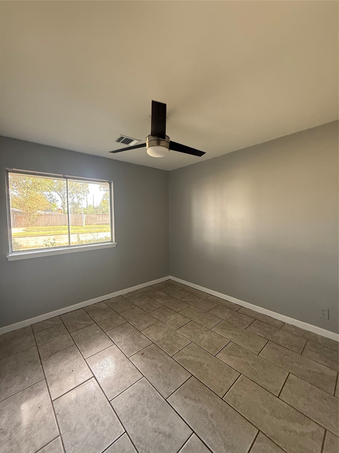 9526 Hammerly Boulevard Houston, TX 77080 - Photo 4 of 16 a view of an empty room with a window