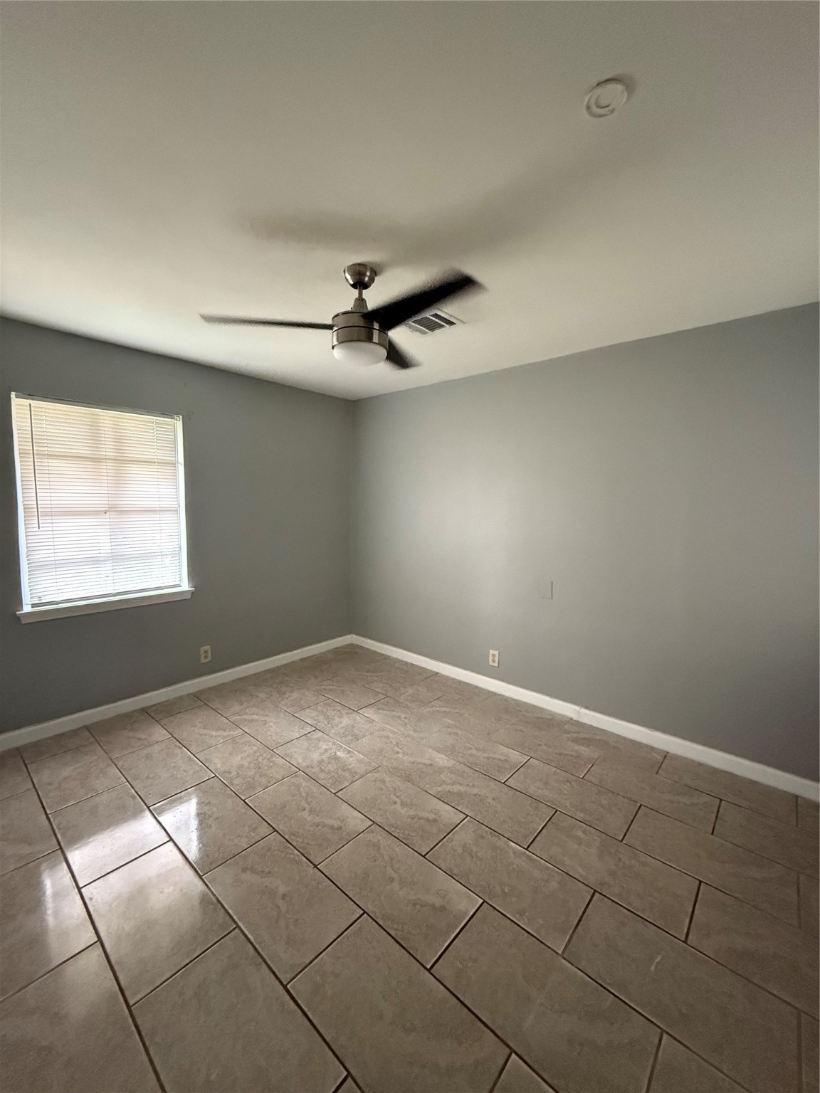9526 Hammerly Boulevard Houston, TX 77080 - Photo 5 of 16 a view of an empty room with a window