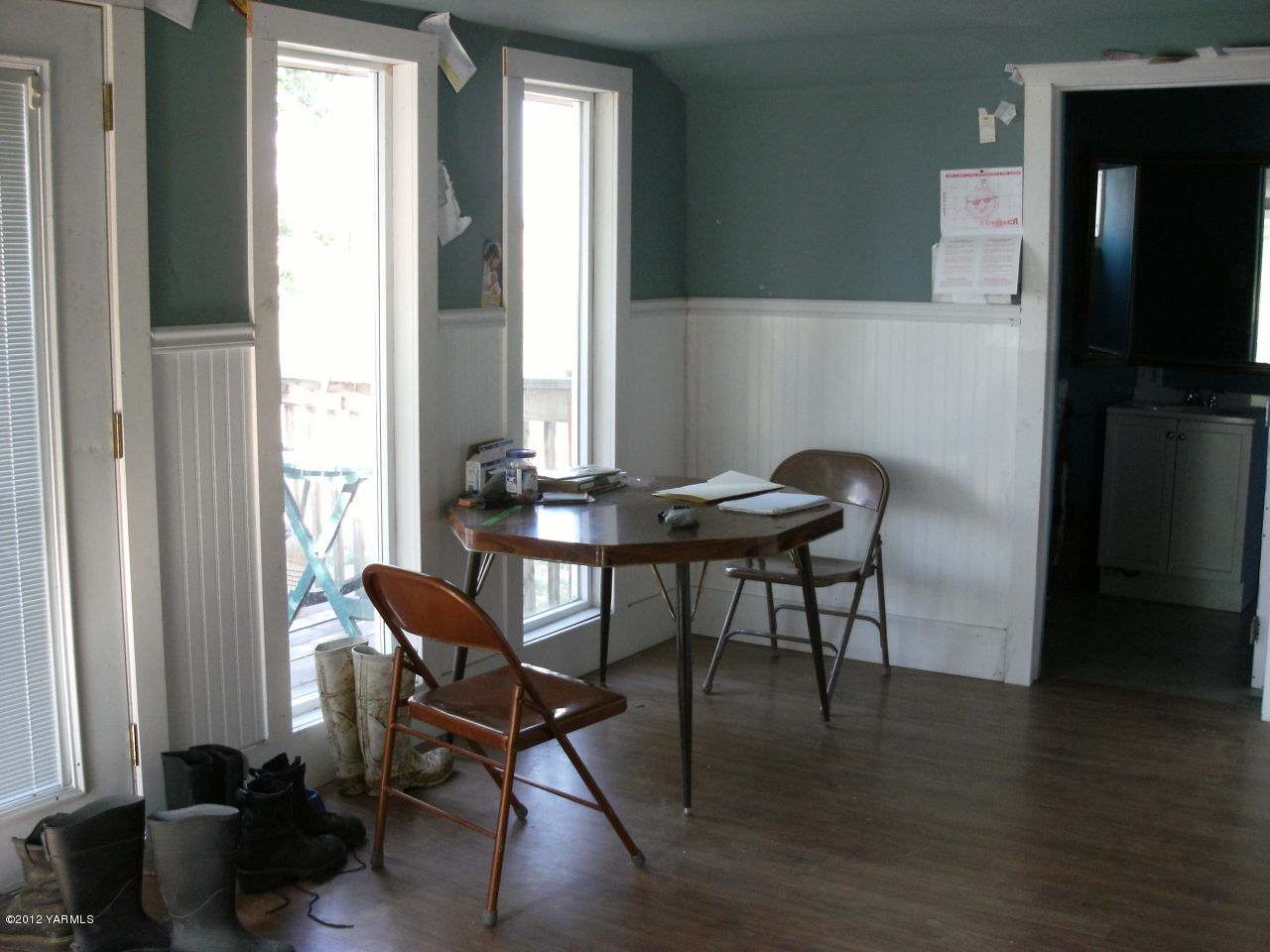 541 Gurley Road Granger, WA 98932 - Photo 3 of 8 a view of a workspace with furniture and a window