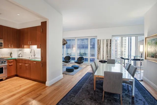 a large kitchen with a table and chairs in it