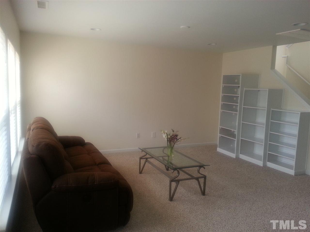 170 Ryder Cup Circle Raleigh, NC 27603 - Photo 11 of 23 a living room with furniture and a window