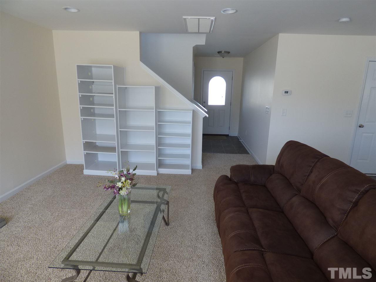 170 Ryder Cup Circle Raleigh, NC 27603 - Photo 12 of 23 a living room with furniture and stairs