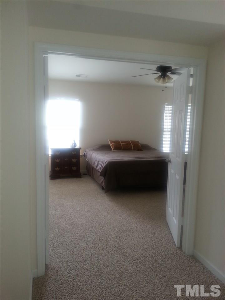 170 Ryder Cup Circle Raleigh, NC 27603 - Photo 13 of 23 a room with a bed and a window