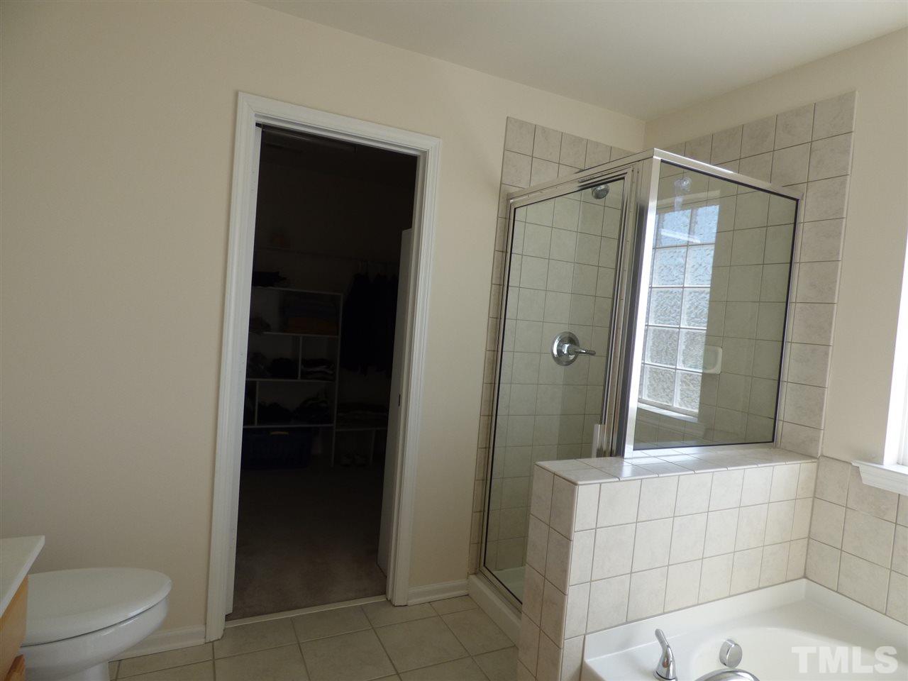 170 Ryder Cup Circle Raleigh, NC 27603 - Photo 15 of 23 a bathroom with a shower and a toilet