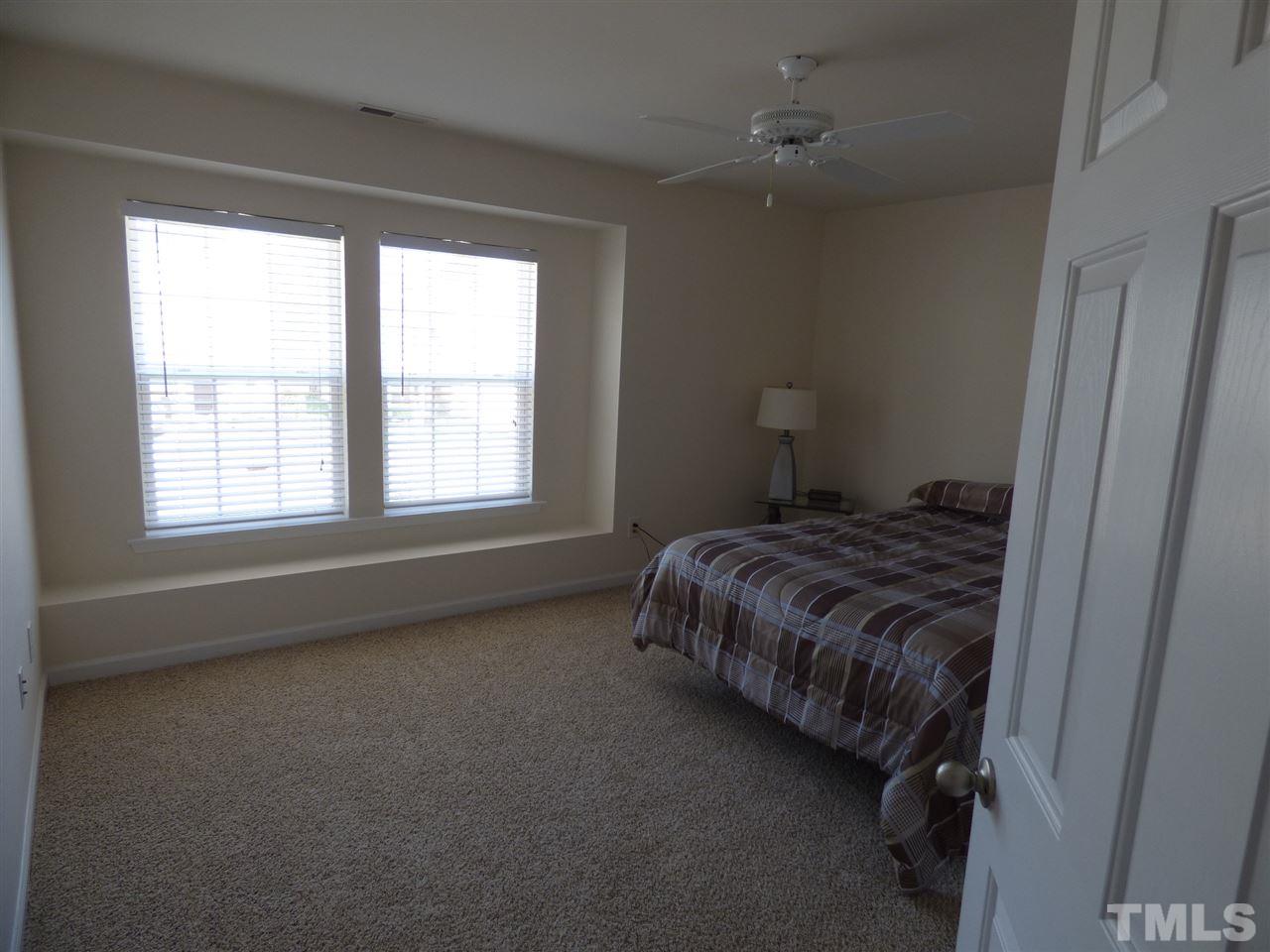 170 Ryder Cup Circle Raleigh, NC 27603 - Photo 18 of 23 a bedroom with a bed and a window