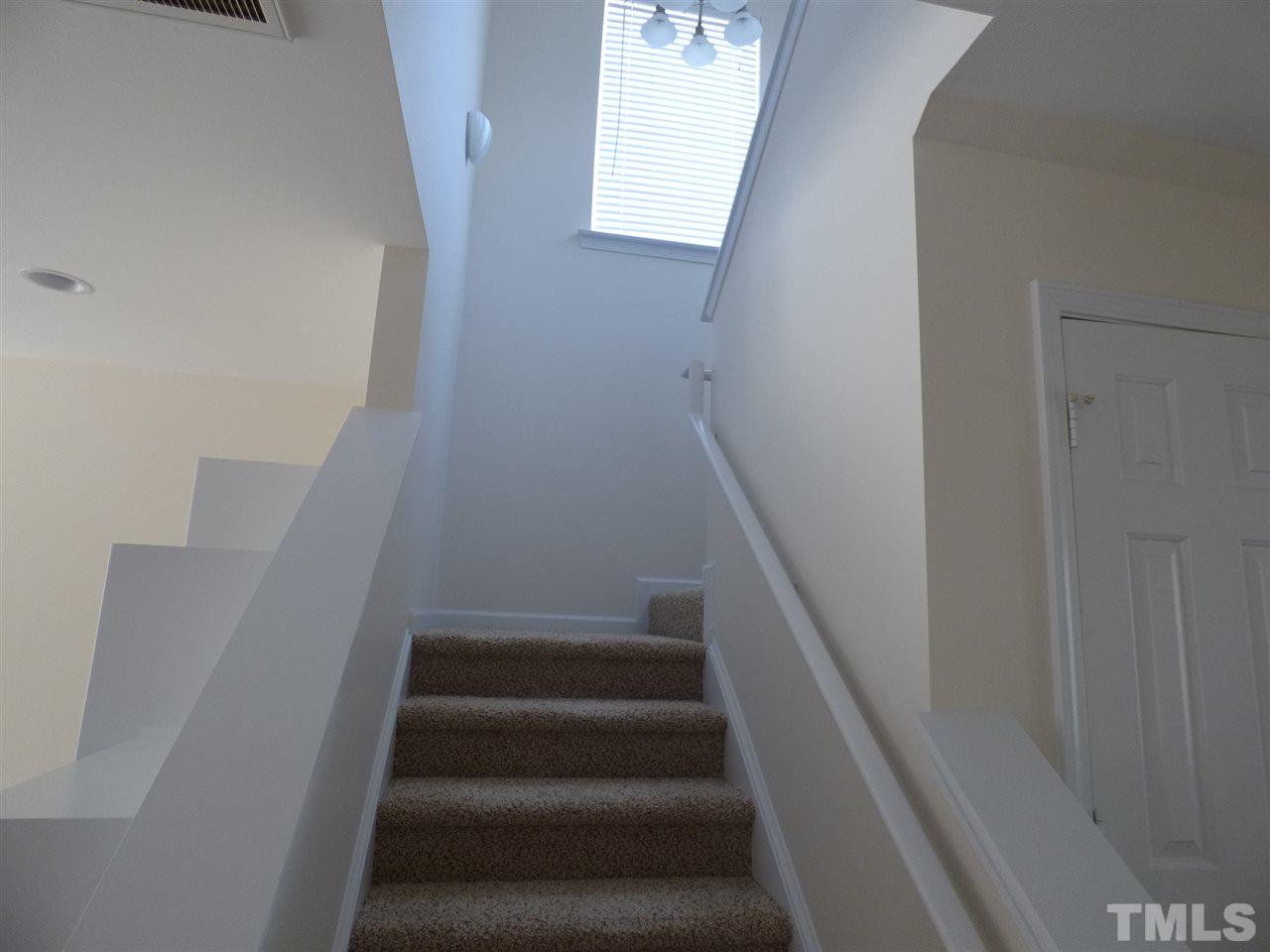 170 Ryder Cup Circle Raleigh, NC 27603 - Photo 20 of 23 a view of staircase with white walls and white door