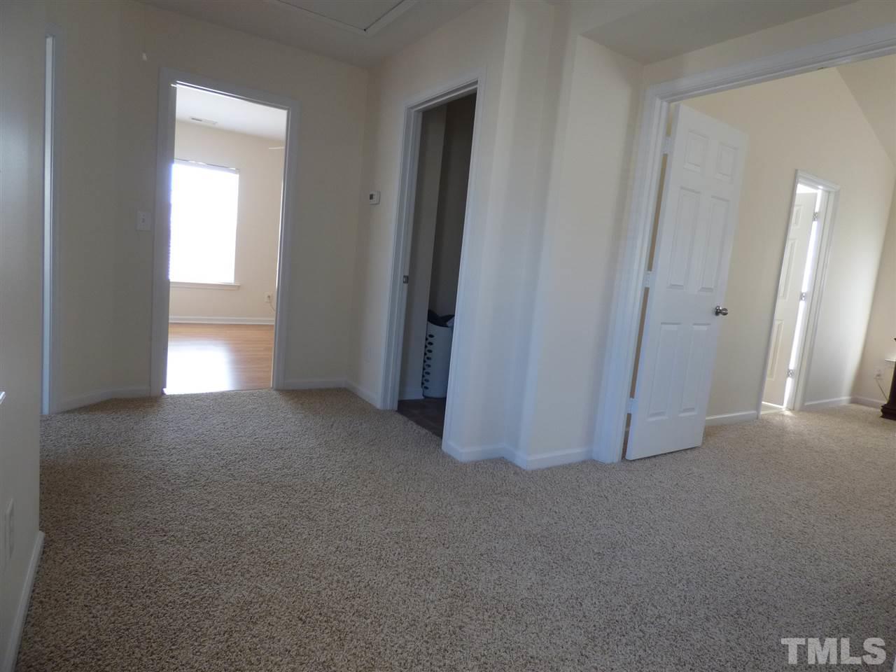 170 Ryder Cup Circle Raleigh, NC 27603 - Photo 21 of 23 a view of empty room with a fireplace