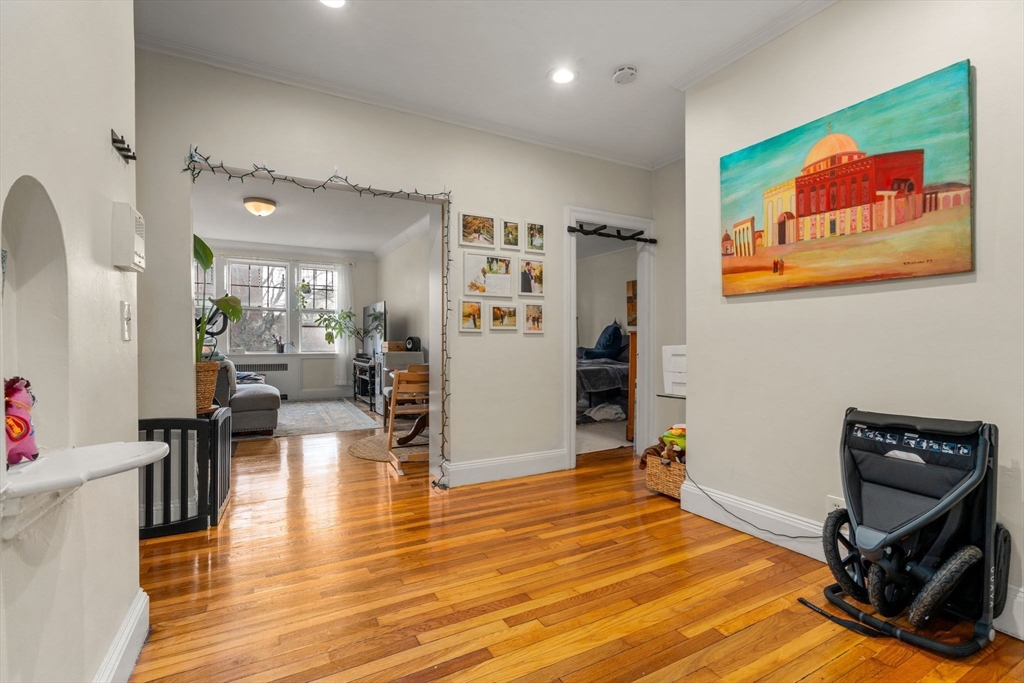 a view of a livingroom with furniture and a flat screen tv
