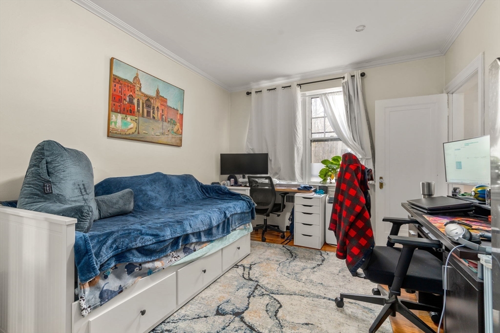 285 Corey Road, Unit 4 Boston, MA 02135 - Photo 18 of 26 a living room with furniture and a flat screen tv