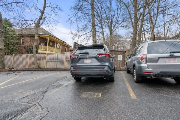 a view of a car parked in front of a house