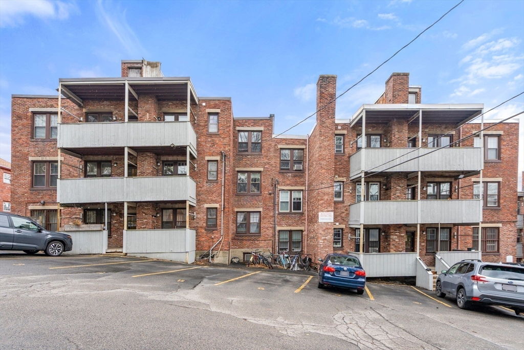 285 Corey Road, Unit 4 Boston, MA 02135 - Photo 20 of 26 a car parked in front of a building