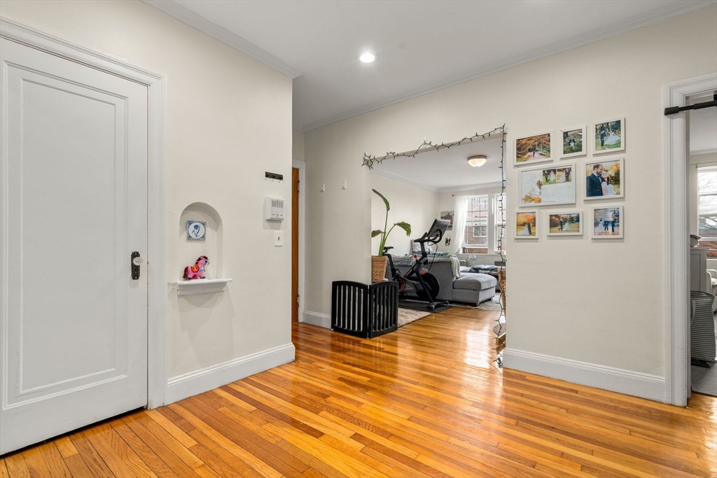 285 Corey Road, Unit 4 Boston, MA 02135 - Photo 2 of 26 a view of a livingroom with furniture and wooden floor