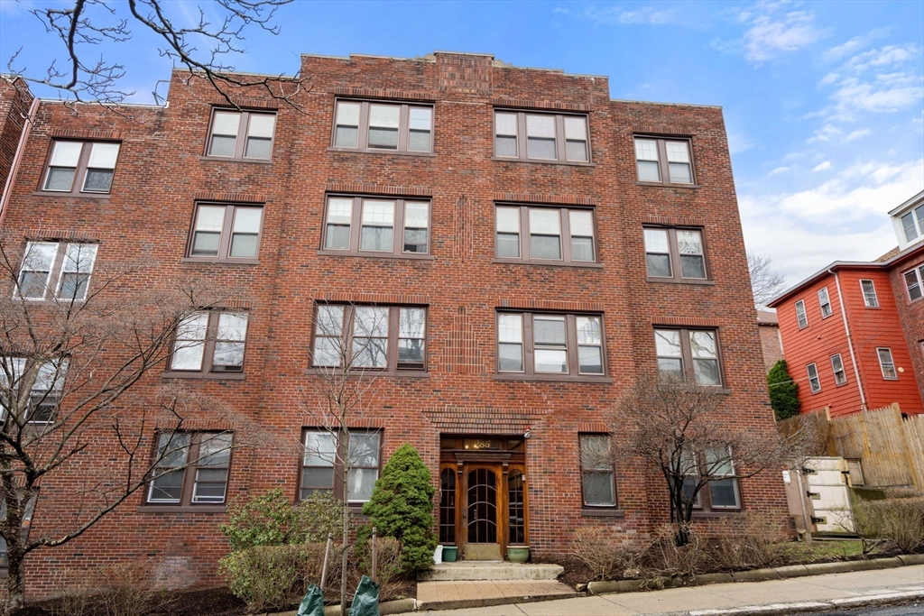 285 Corey Road, Unit 4 Boston, MA 02135 - Photo 23 of 26 a large building with a lot of windows