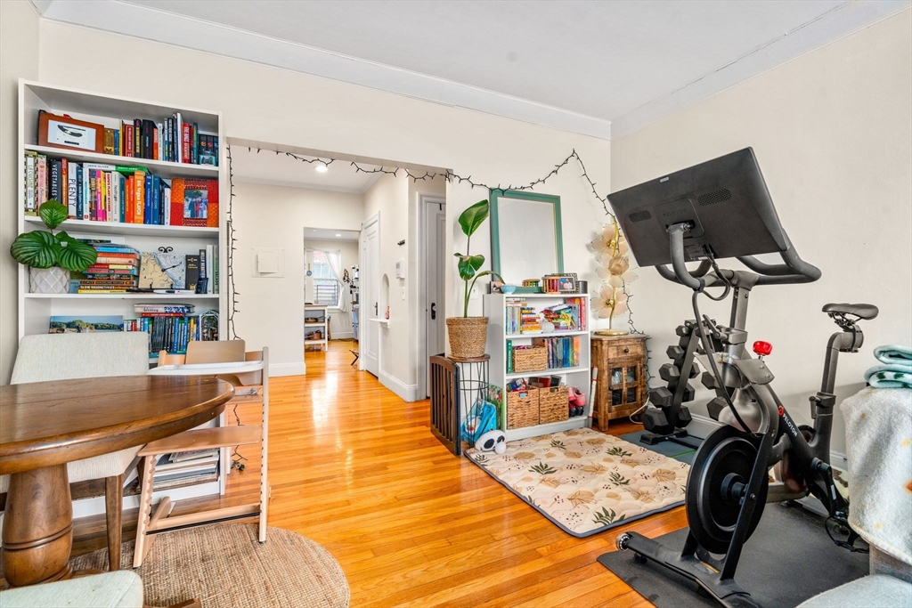 285 Corey Road, Unit 4 Boston, MA 02135 - Photo 5 of 26 a living room with furniture and a flat screen tv