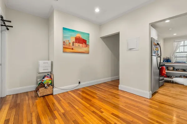 a view of a livingroom with wooden floor