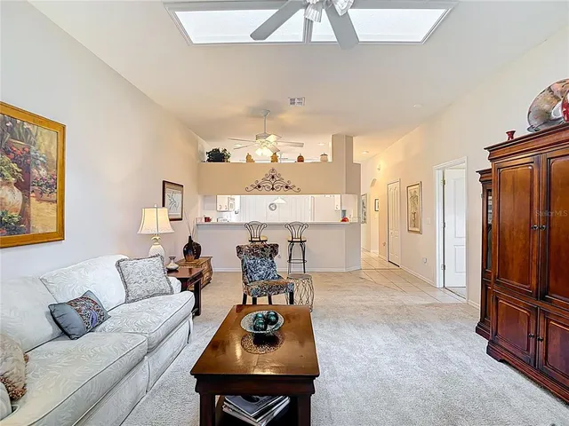 a kitchen with cabinets appliances a sink and a window