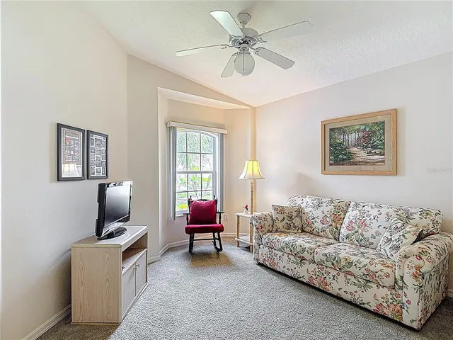a view of a room with furniture and a potted plant