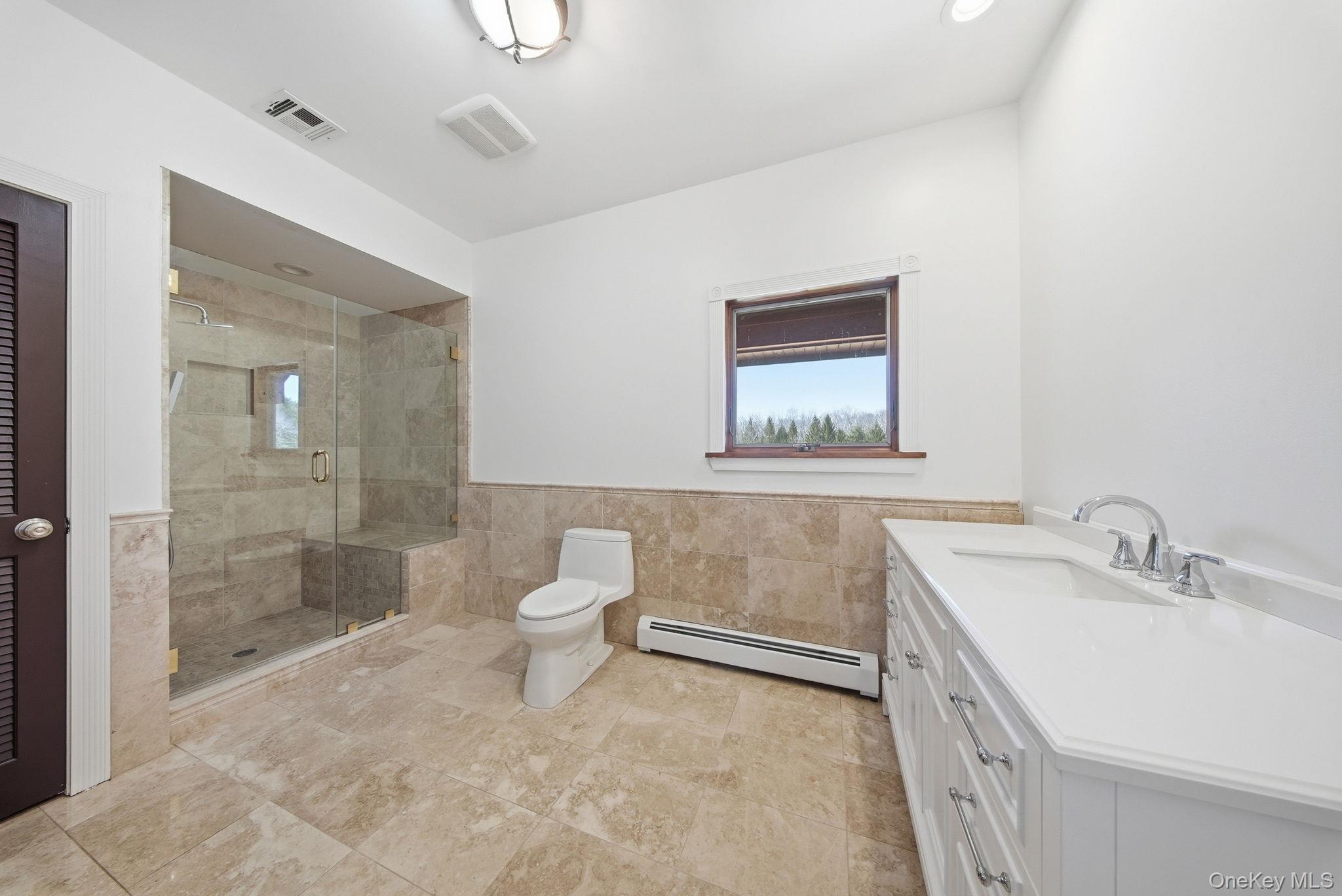 58 Deer Meadow Road White Lake, NY 12786 - Photo 12 of 50 a bathroom with a sink a toilet and shower