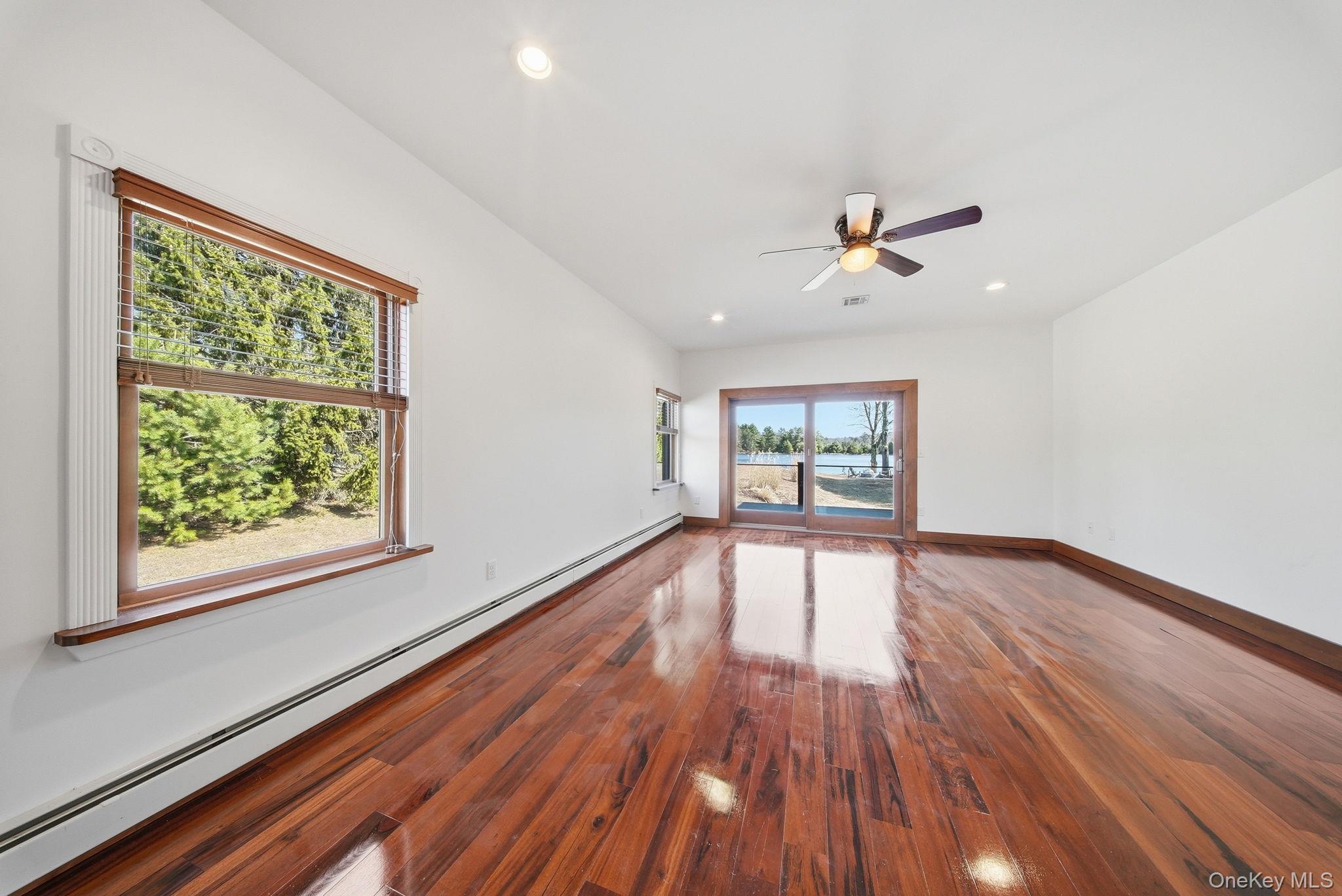 58 Deer Meadow Road White Lake, NY 12786 - Photo 16 of 50 a view of an empty room with wooden floor and a window