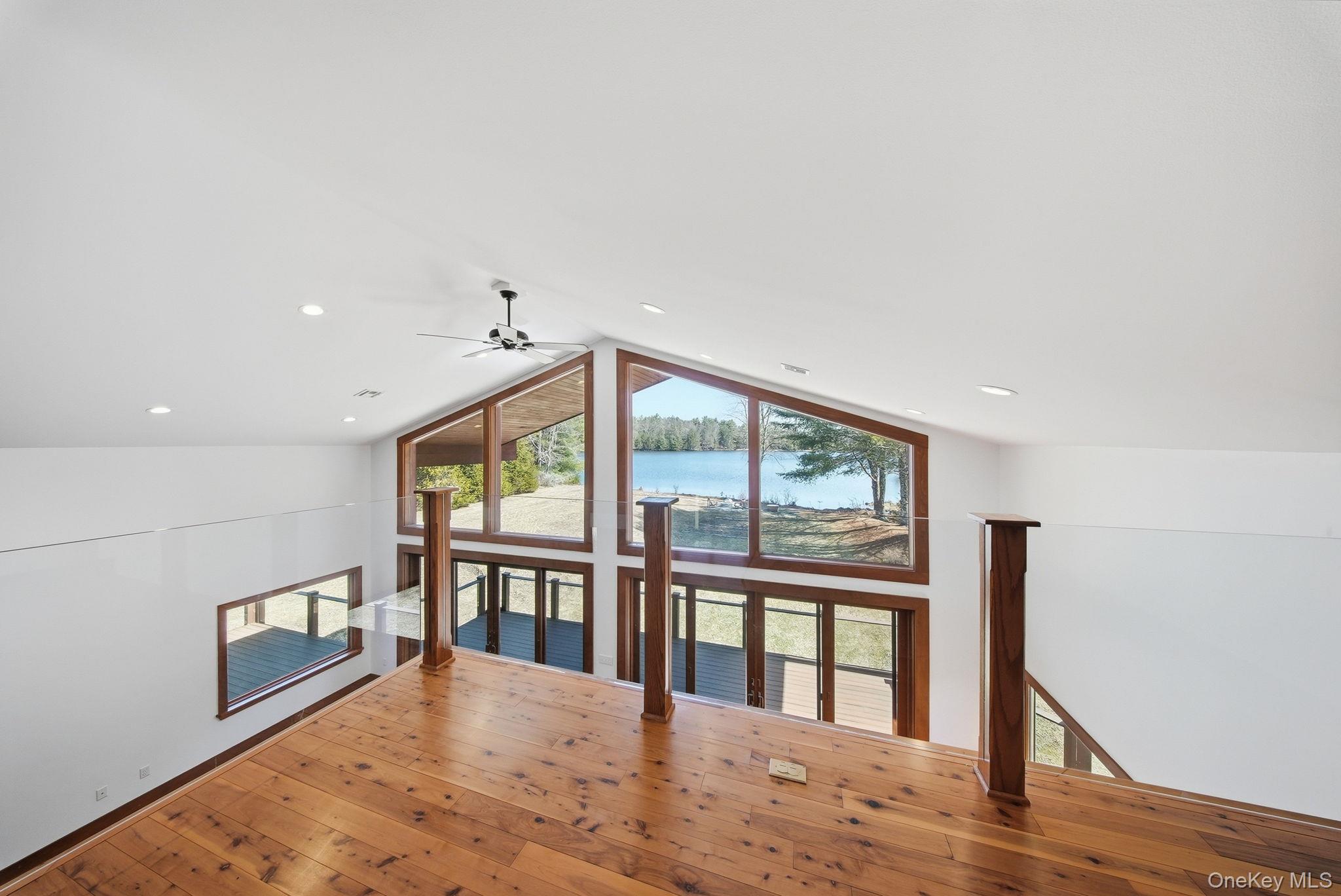 58 Deer Meadow Road White Lake, NY 12786 - Photo 21 of 50 a view of an empty room with wooden floor and a window