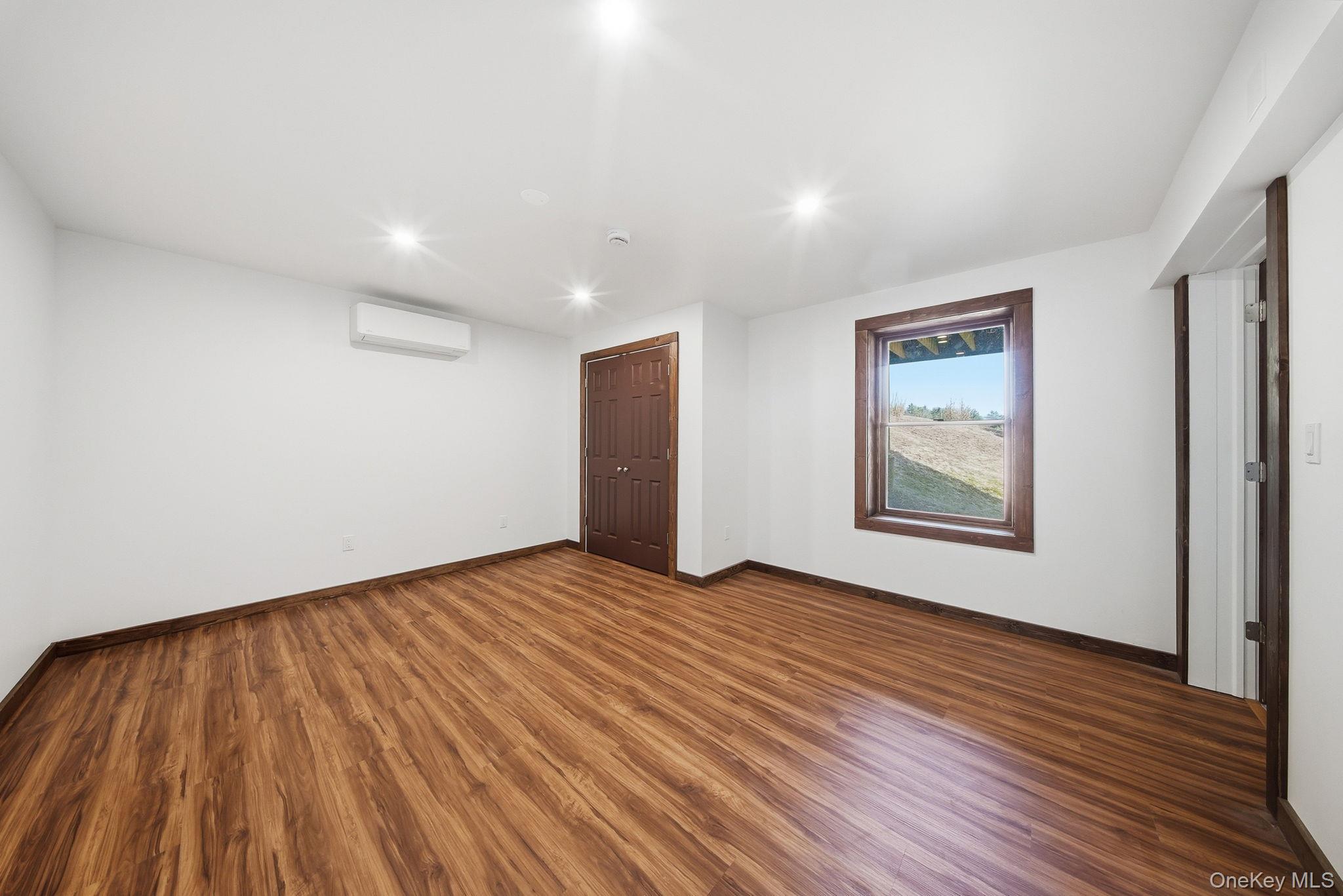 58 Deer Meadow Road White Lake, NY 12786 - Photo 26 of 50 a view of an empty room with wooden floor and a window