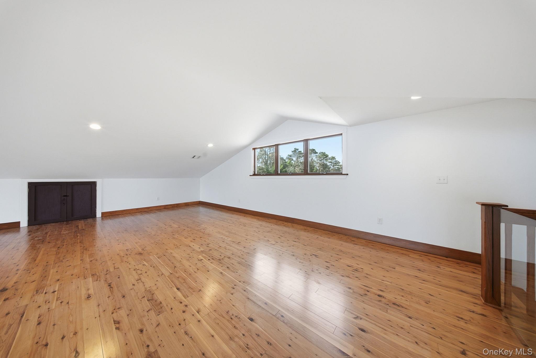58 Deer Meadow Road White Lake, NY 12786 - Photo 27 of 50 a view of an empty room with wooden floor and a window