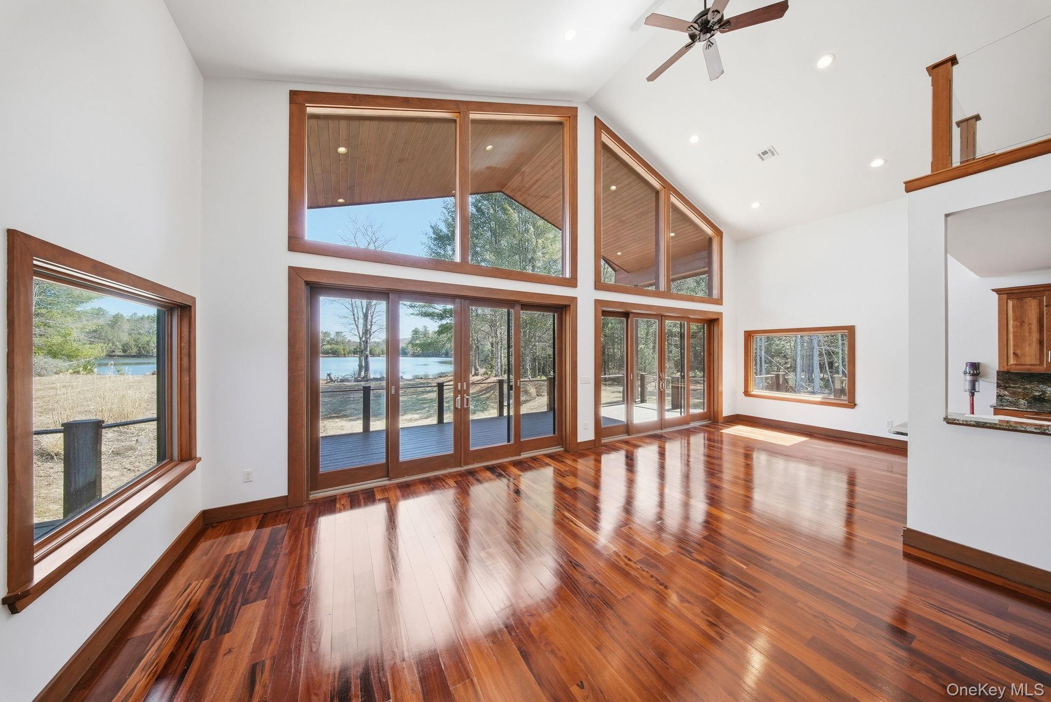 58 Deer Meadow Road White Lake, NY 12786 - Photo 28 of 50 a view of an empty room with wooden floor and windows