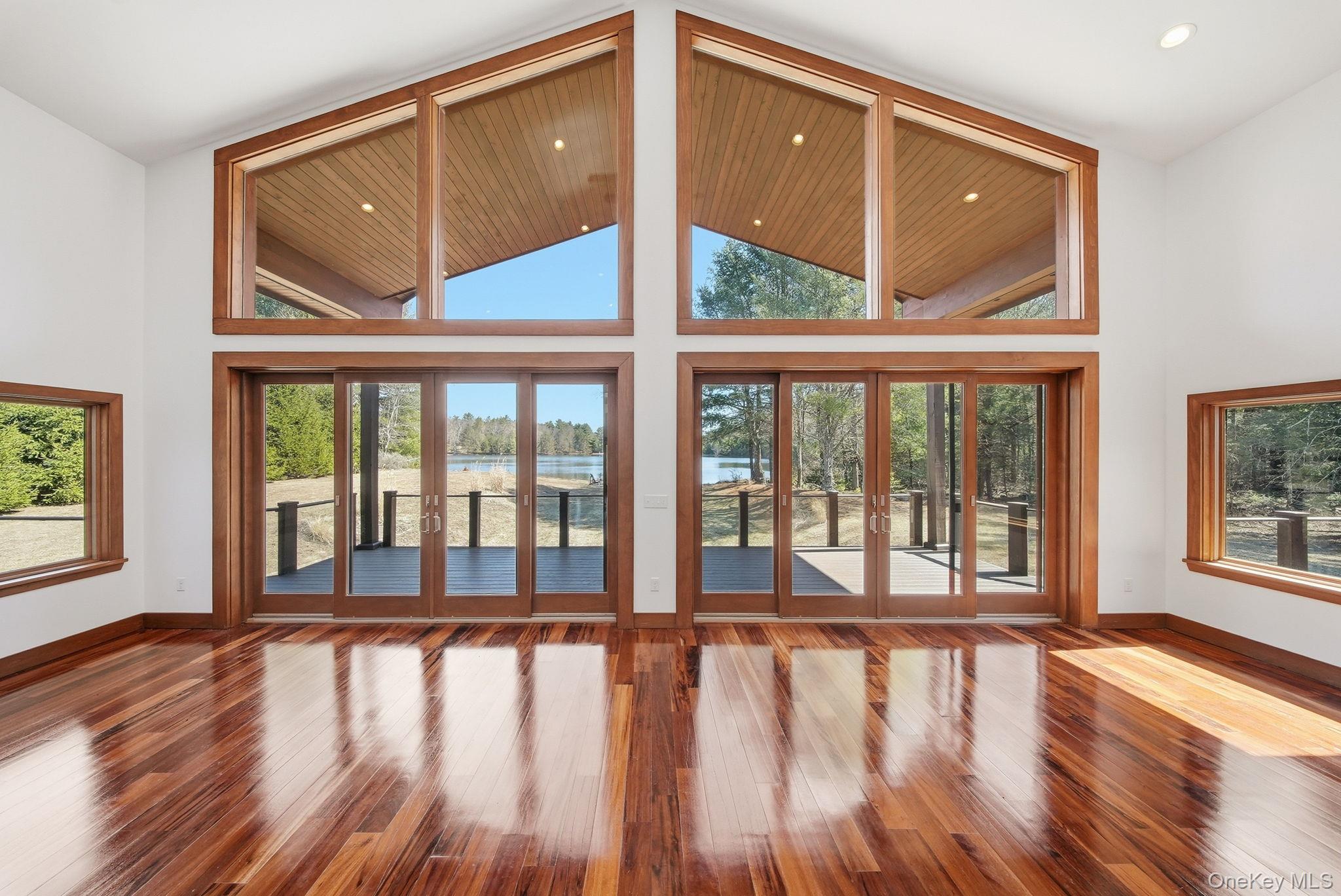 58 Deer Meadow Road White Lake, NY 12786 - Photo 5 of 50 a view of an empty room with wooden floor and a window
