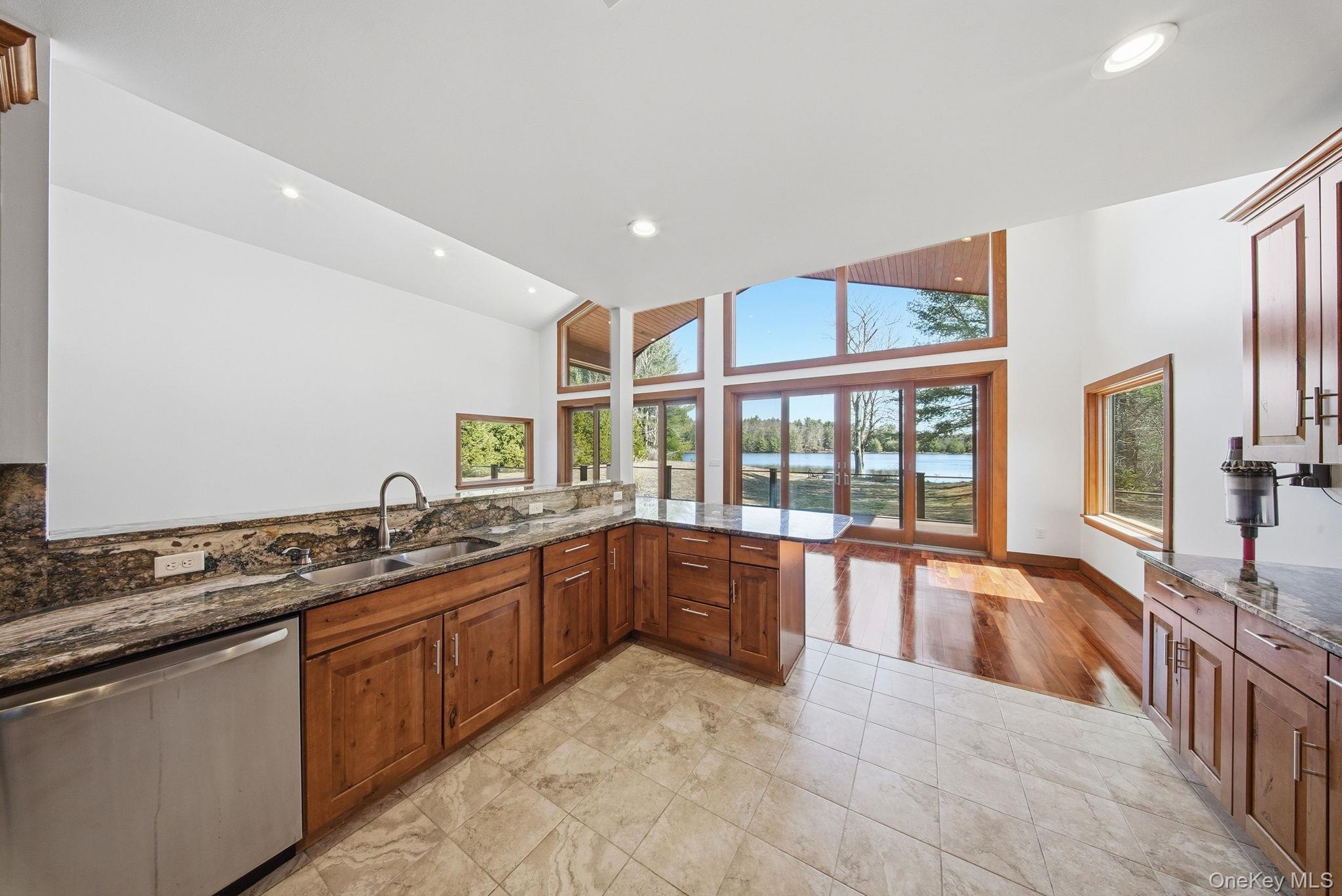 58 Deer Meadow Road White Lake, NY 12786 - Photo 8 of 50 a large kitchen with stainless steel appliances granite countertop a large stove a sink and a refrigerator