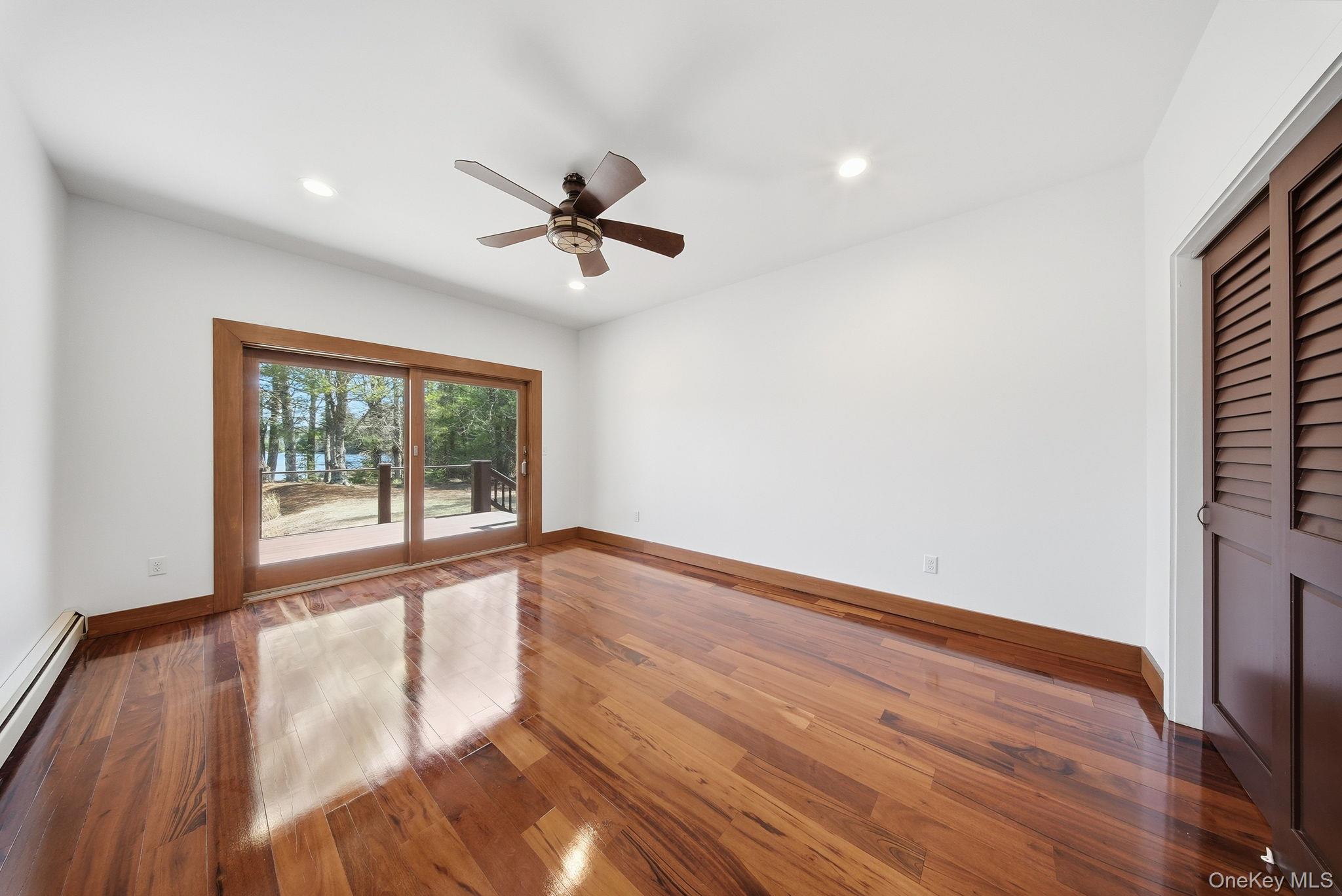 58 Deer Meadow Road White Lake, NY 12786 - Photo 9 of 50 a view of empty room with wooden floor and fan
