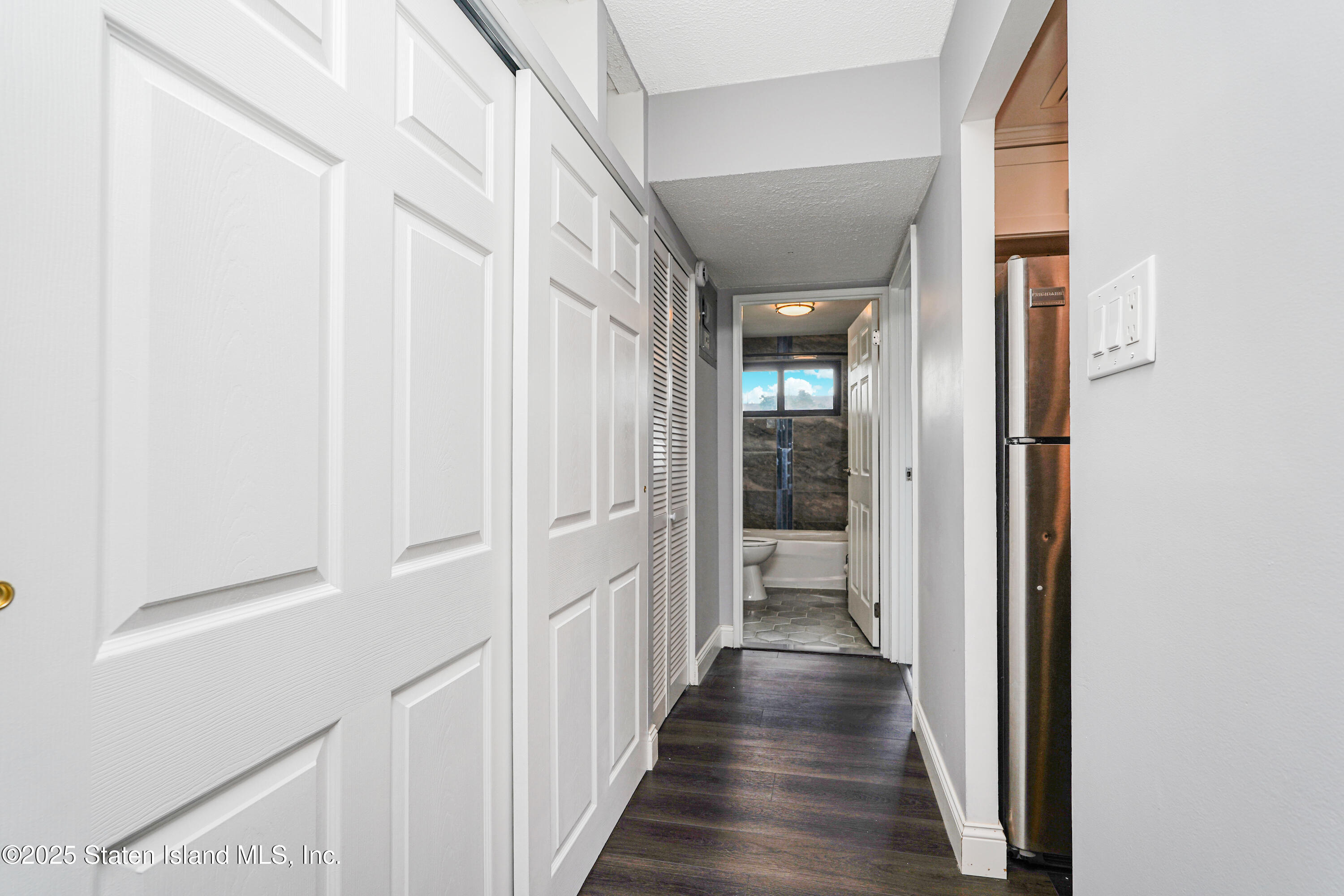 11 Windham Loop, Unit 3II Staten Island, NY 10314 - Photo 14 of 18 a view of a hallway with wooden floor