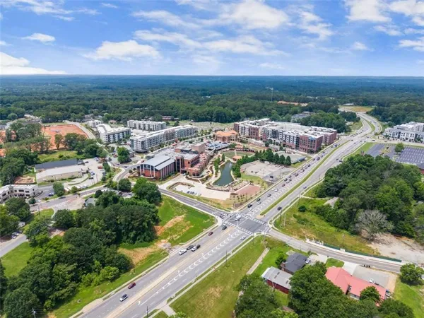 an aerial view of residential houses with outdoor space