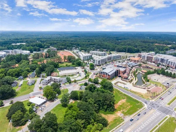 an aerial view of residential houses with outdoor space