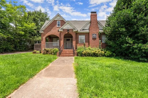 a front view of a house with a yard