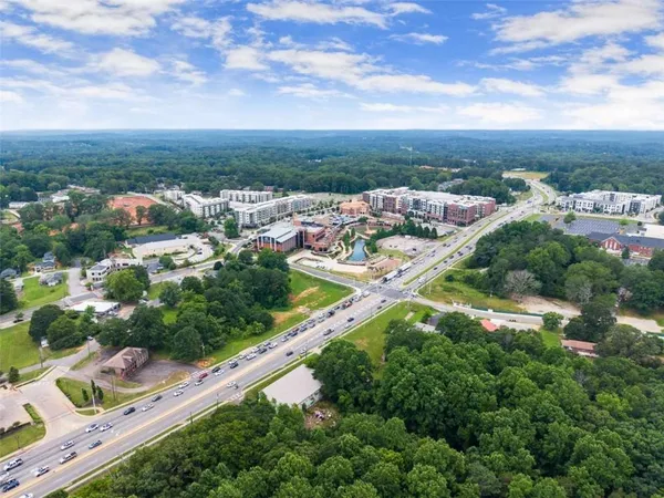 an aerial view of residential houses with outdoor space